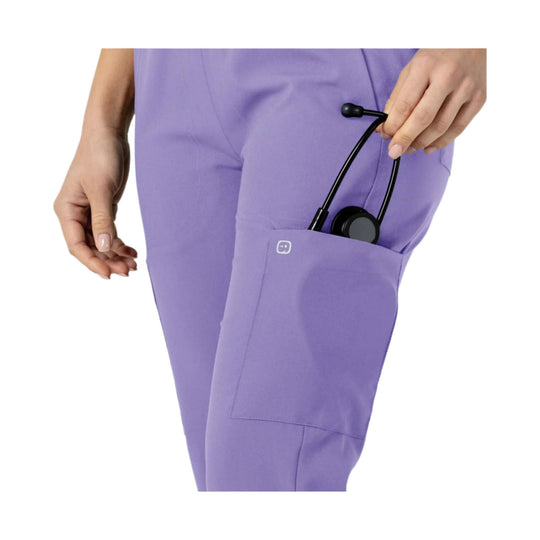 Lavender scrub pants with side cargo pocket and a stethoscope tucked into the pocket