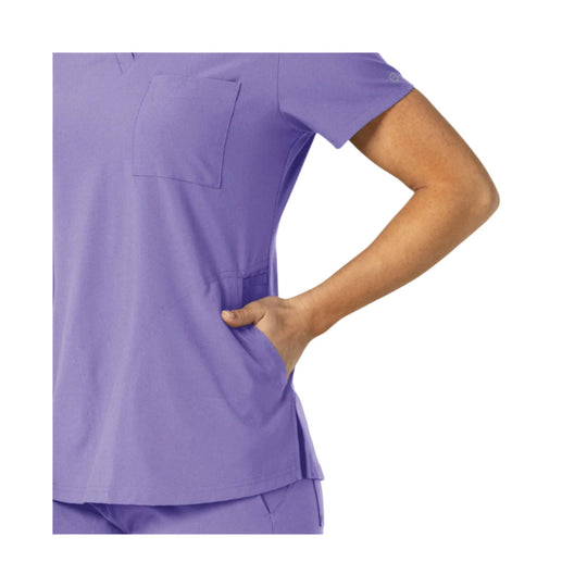 Lavender short-sleeve scrub top with chest pocket and side slit hem