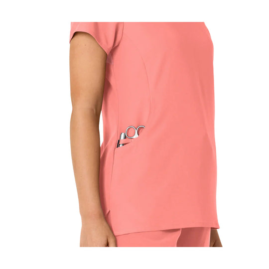 Coral short-sleeve scrub top with side pocket detail and matching pants