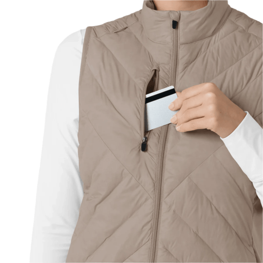 Beige quilted zip-front vest with a high collar and side chest pocket