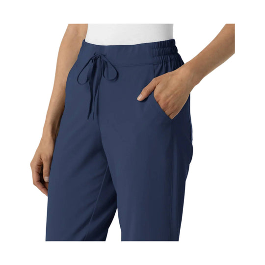 Navy jogger scrub pants with elastic waistband, drawstring tie, and side pockets