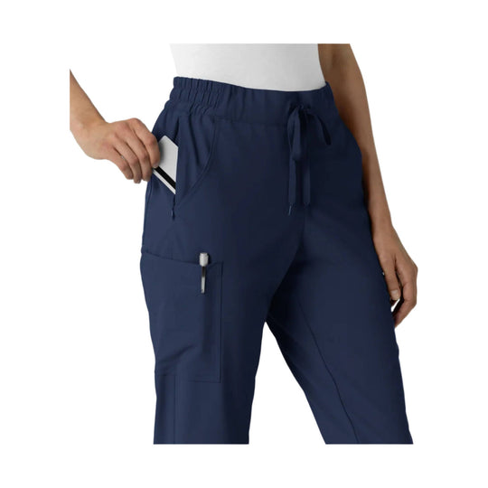 Navy jogger scrub pants with elastic waistband, drawstring tie, and side cargo pocket