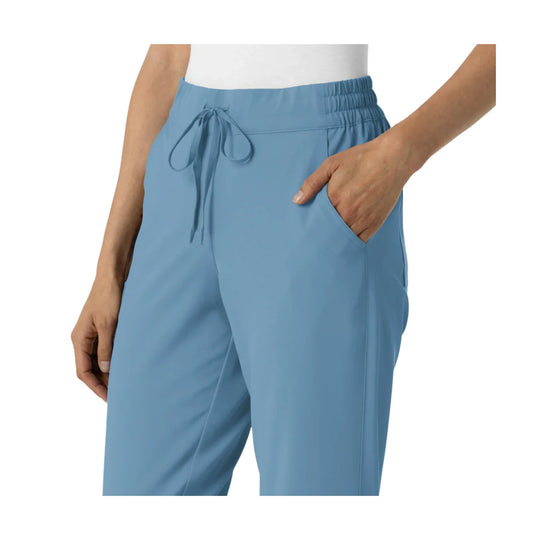 Light blue jogger scrub pants with elastic waistband, drawstring, and side pockets