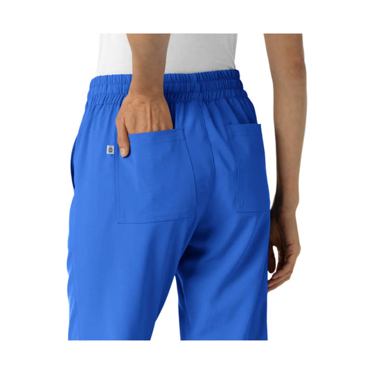 Blue jogger scrub pants with an elastic waistband and patch back pockets