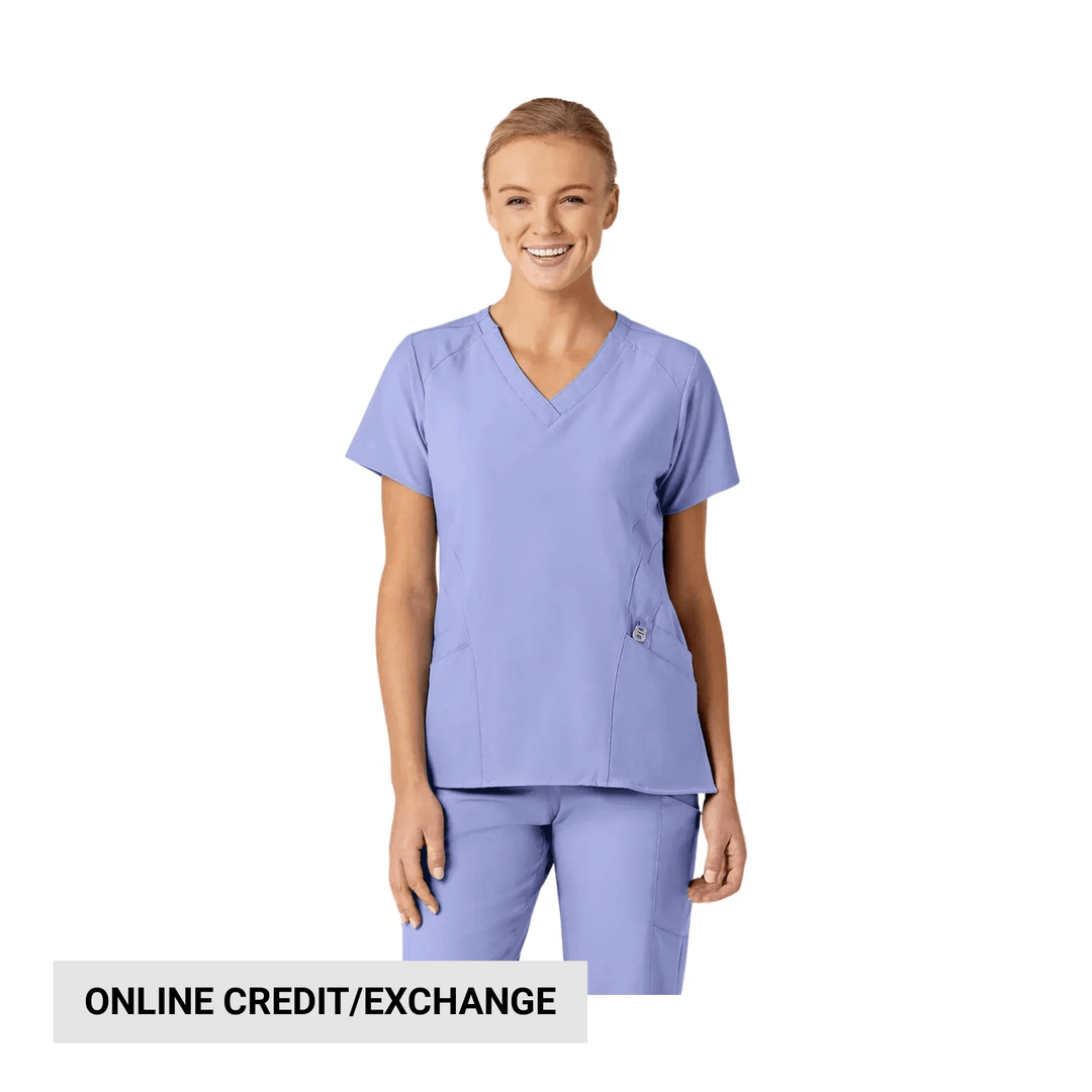 Lavender V-neck scrub top and matching scrub pants on a model