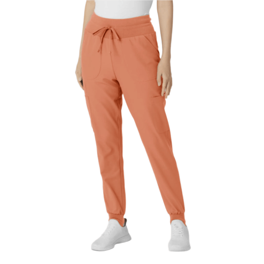 Coral jogger scrub pants with a wide knit waistband, drawstring, and tapered cuffs