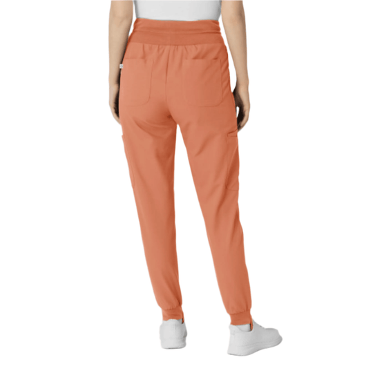 Coral jogger scrub pants with elastic waistband, front pockets, and cuffed ankles