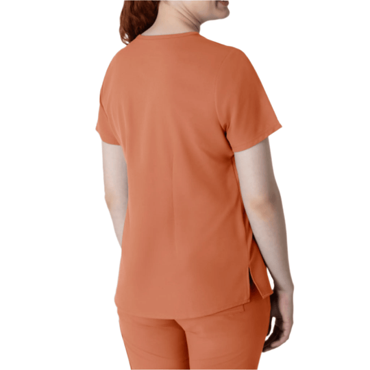 Terracotta short-sleeve V-neck scrub top shown from the back on a model