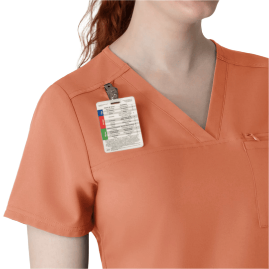 Orange V-neck scrub top with short sleeves and a chest pocket, shown with a hanging size tag