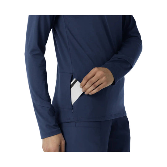 Navy long-sleeve athletic top with a side pocket opening