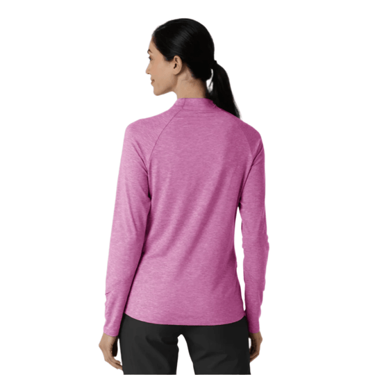 Woman wearing a pink long-sleeve quarter-zip top, shown from the back