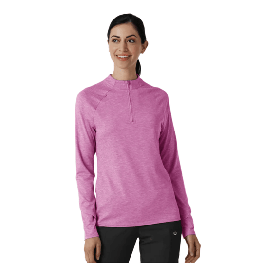 Woman wearing a pink long-sleeve quarter-zip top with a heathered finish and black pants