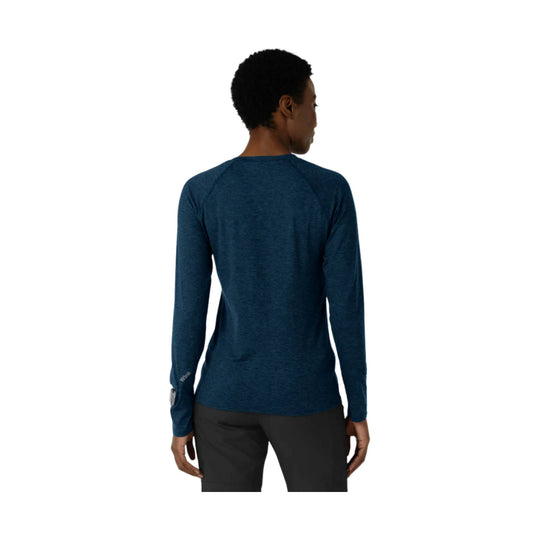 Long-sleeve navy heather athletic top shown from the back