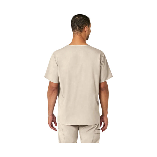 Back view of a beige short-sleeve scrub top with matching scrub pants