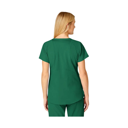 Green short-sleeve scrub top shown from the back on a model.