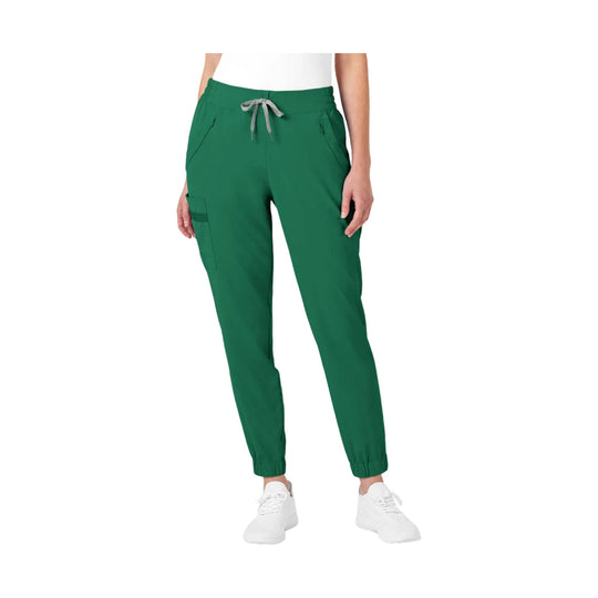 Green jogger scrub pants with drawstring waist and cargo pocket, shown with white sneakers