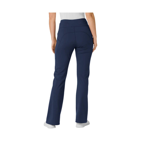 Navy flared yoga scrub pants shown from the back