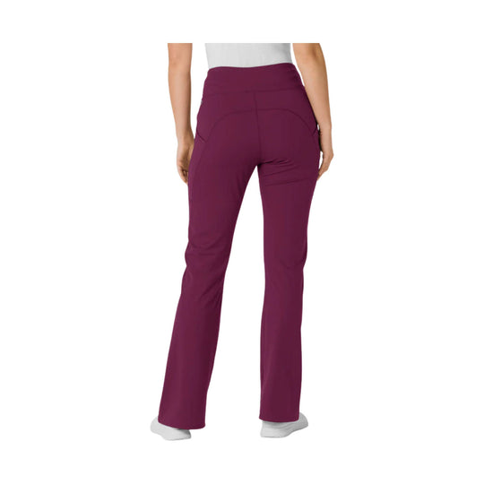 Back view of women’s high-waisted flared scrub pants with rear pockets