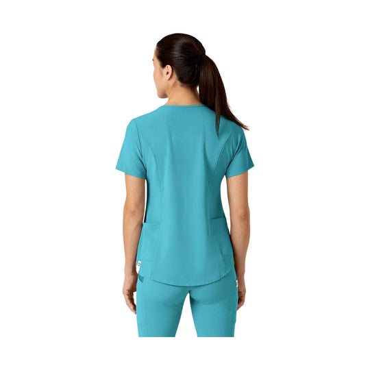 Teal V-neck scrub top shown from the back, with short sleeves, fitted seams, and lower patch pockets.