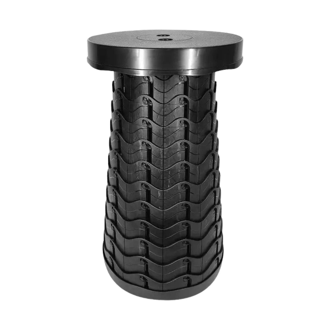 Black telescoping stool with stacked segmented sides and a round top