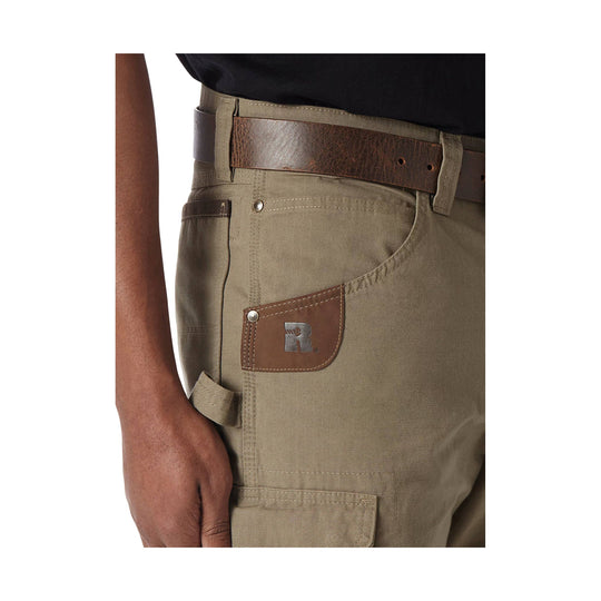 Tan cargo shorts with a brown leather belt and a leather logo patch on the front pocket