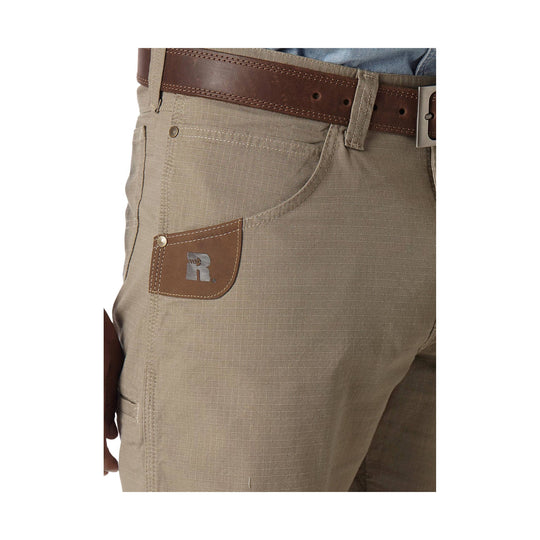 Khaki work shorts with a leather belt, front pocket, and branded leather coin pocket patch