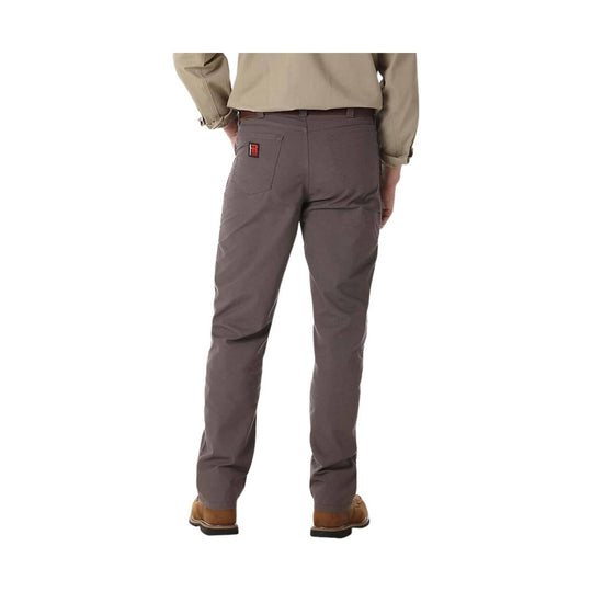 Person wearing gray pants on a white background