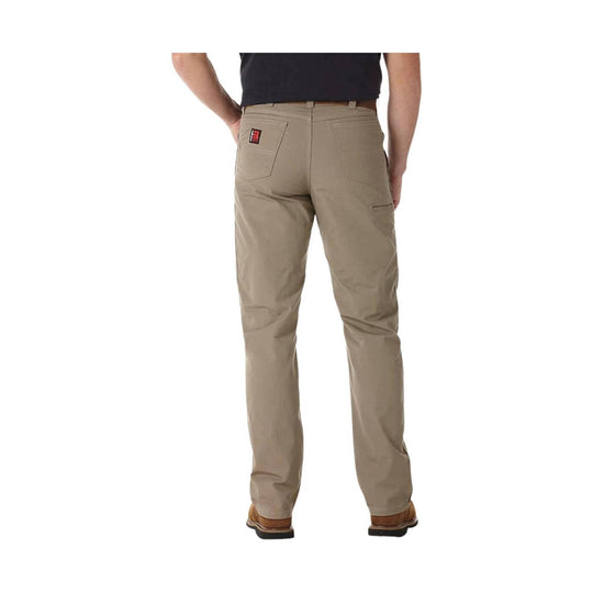 Beige pants worn by a person on a white background
