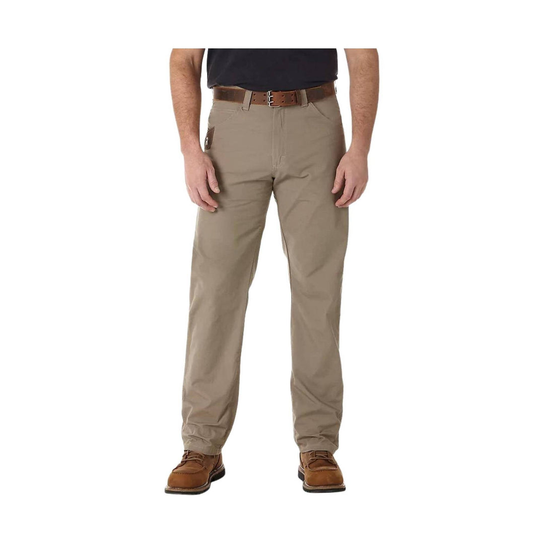 Beige pants worn by a person on a white background