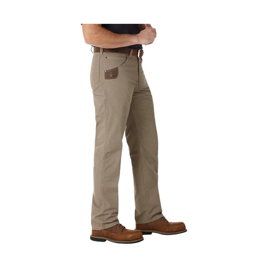 Beige pants worn by a person on a white background
