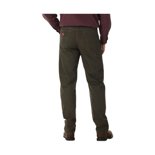 Person wearing green pants on a white background