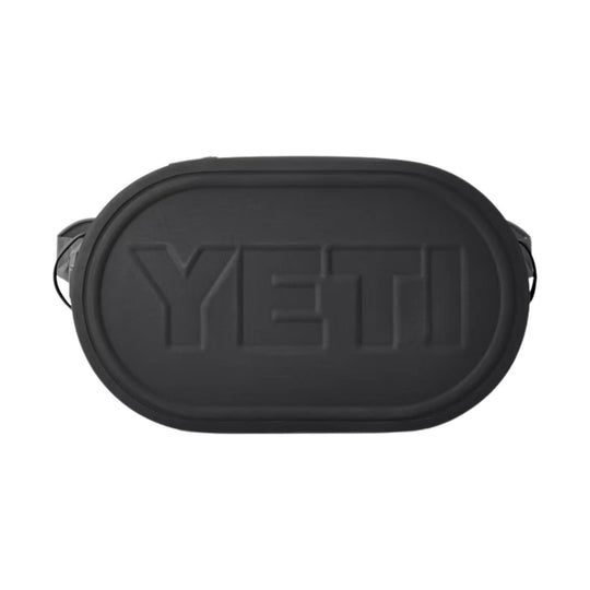 Black oval soft cooler with embossed YETI logo