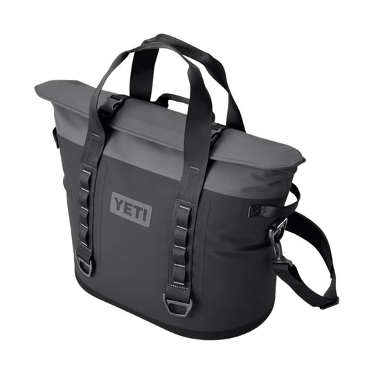 Dark gray roll-top soft cooler bag with black straps and YETI logo