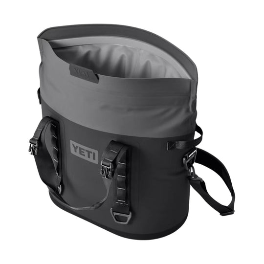 Gray soft-sided cooler tote with shoulder strap and front buckles, shown open