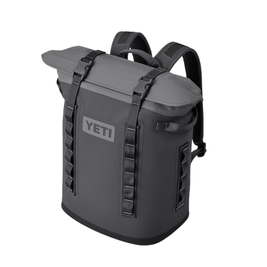 Gray roll-top backpack cooler with black straps and visible YETI logo