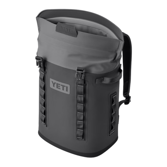 Gray backpack-style soft cooler with front logo, top roll opening, and side carry handle