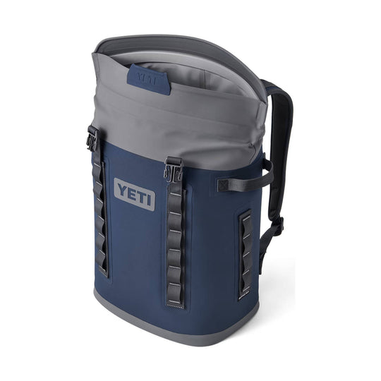 Blue and gray backpack-style soft cooler with front straps and a top carry handle
