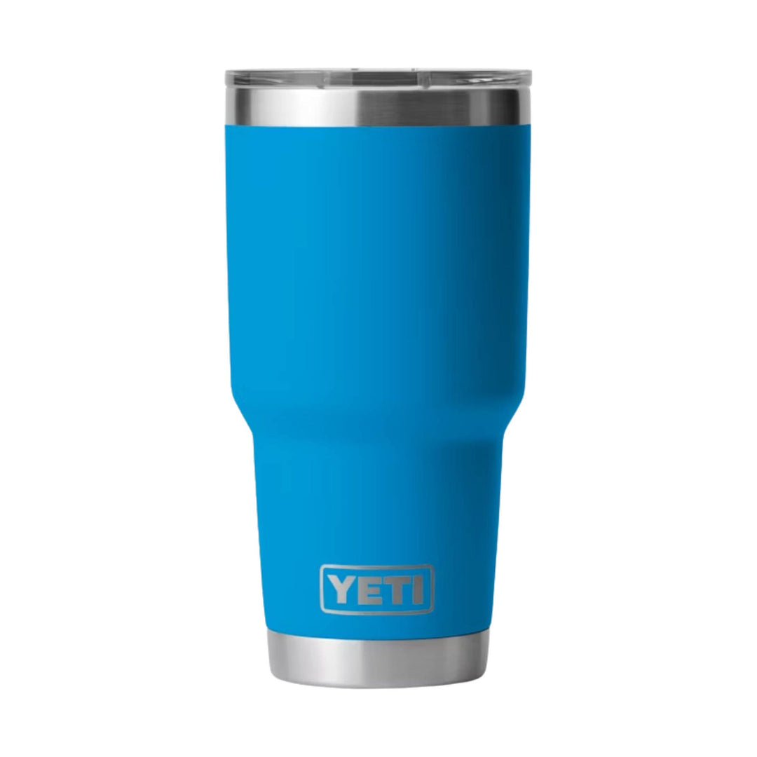 Blue insulated tumbler with a stainless steel rim and base, showing the YETI logo