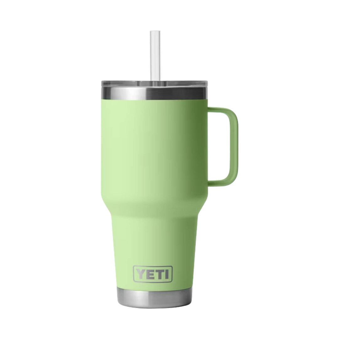 Light green insulated tumbler with a handle, clear straw, stainless steel lid and base, and YETI logo