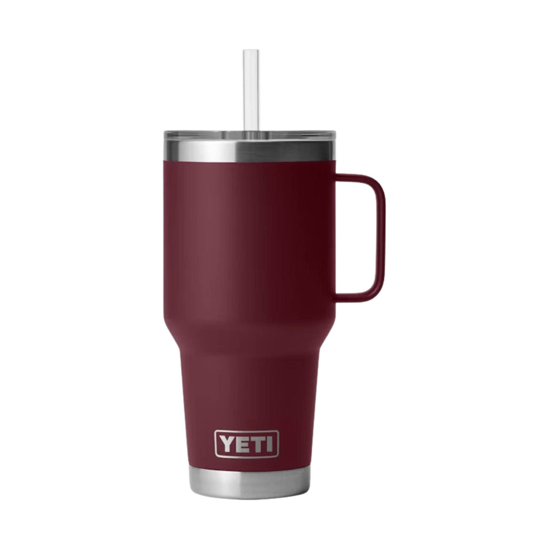 Tall burgundy stainless steel travel mug with handle, clear straw, and YETI logo