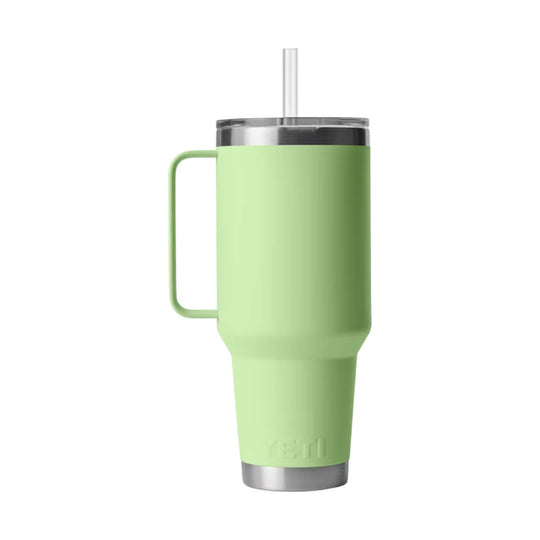 Light green handled tumbler with clear lid, straw, and embossed YETI logo