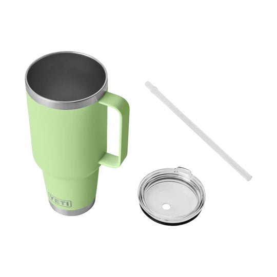 Light green insulated tumbler with handle, clear lid, and white straw