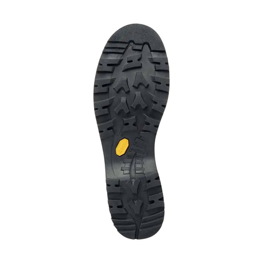 Black lugged hiking boot outsole with a yellow Vibram insert