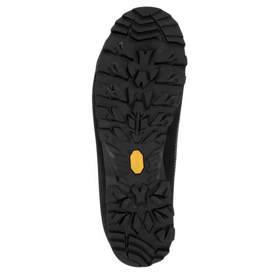 Black hiking boot outsole with deep lug tread and a yellow Vibram label