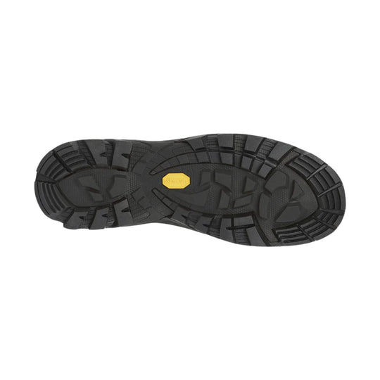 Black hiking boot outsole with deep lug tread and a yellow Vibram badge