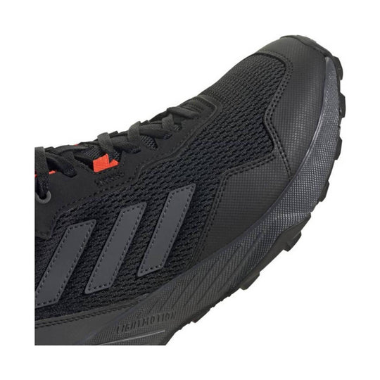 Black athletic trail shoe with knit upper, three side stripes, and a textured lug sole