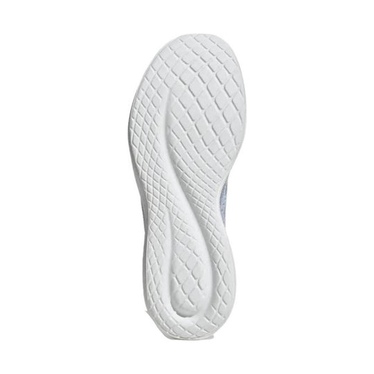 White sneaker outsole with textured diamond tread and a central groove