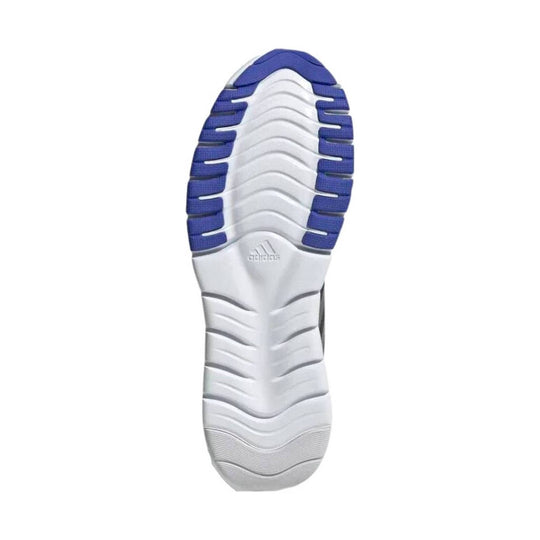White sneaker outsole with blue traction pods and an adidas logo near the midfoot.