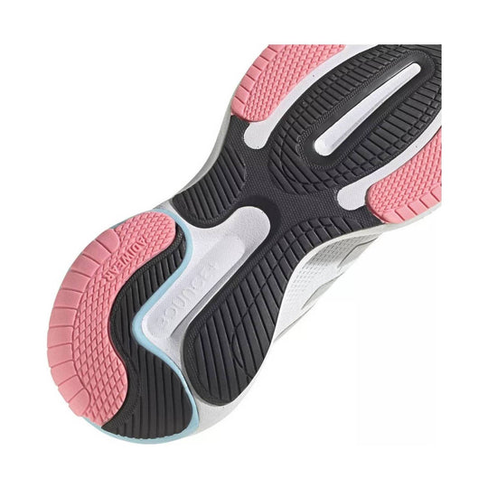 Black, white, and pink sneaker outsole with textured rubber tread and embossed ADIDAS text