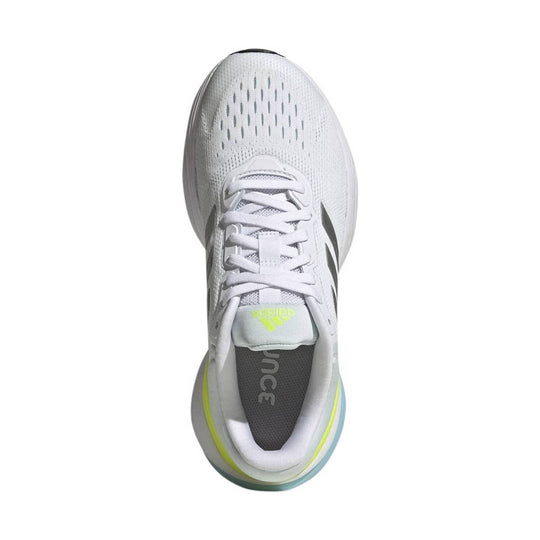 White running shoe with laces, perforated toe box, gray interior, and neon yellow and blue accents